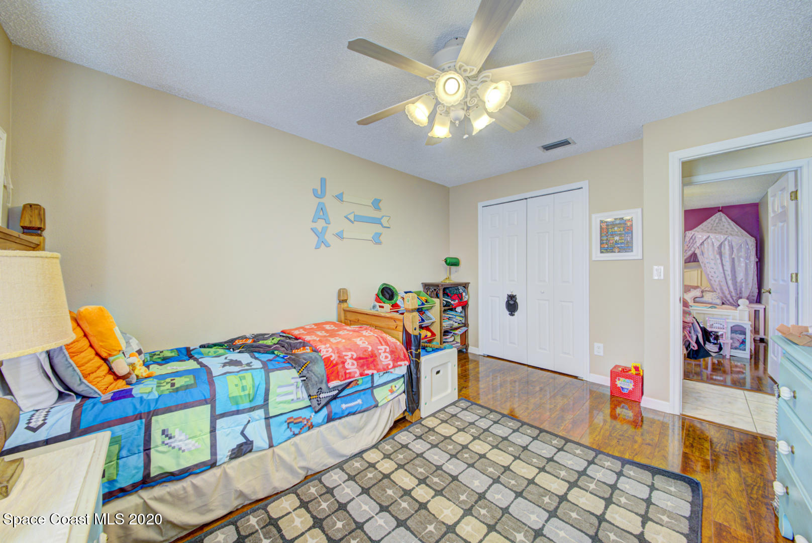 4359 Eastman Street Cocoa, FL 32927 - Photo 38 of 52 a bedroom with furniture and a chandelier