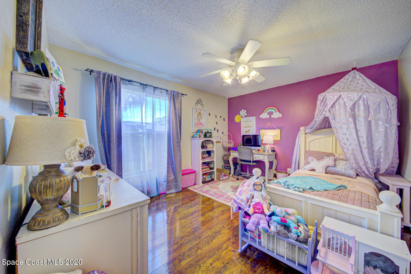 4359 Eastman Street Cocoa, FL 32927 - Photo 40 of 52 a bed room with a bed mirror and a window