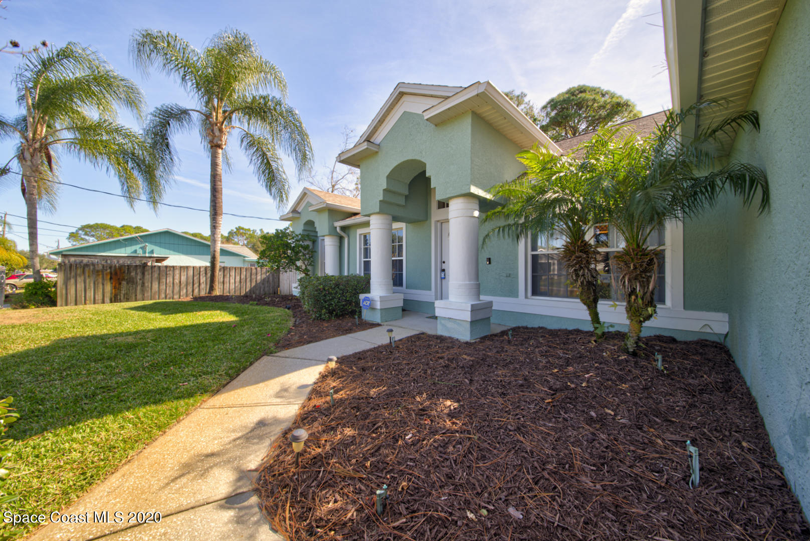 4359 Eastman Street Cocoa, FL 32927 - Photo 5 of 52 a front view of a house with a garden
