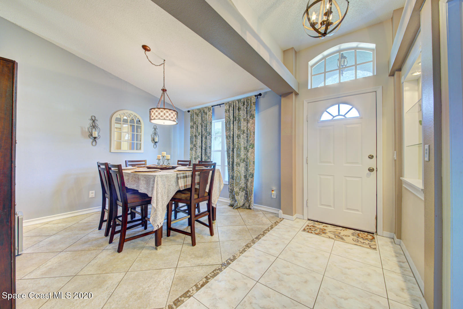 4359 Eastman Street Cocoa, FL 32927 - Photo 7 of 52 a view of a dining room with furniture and chandelier