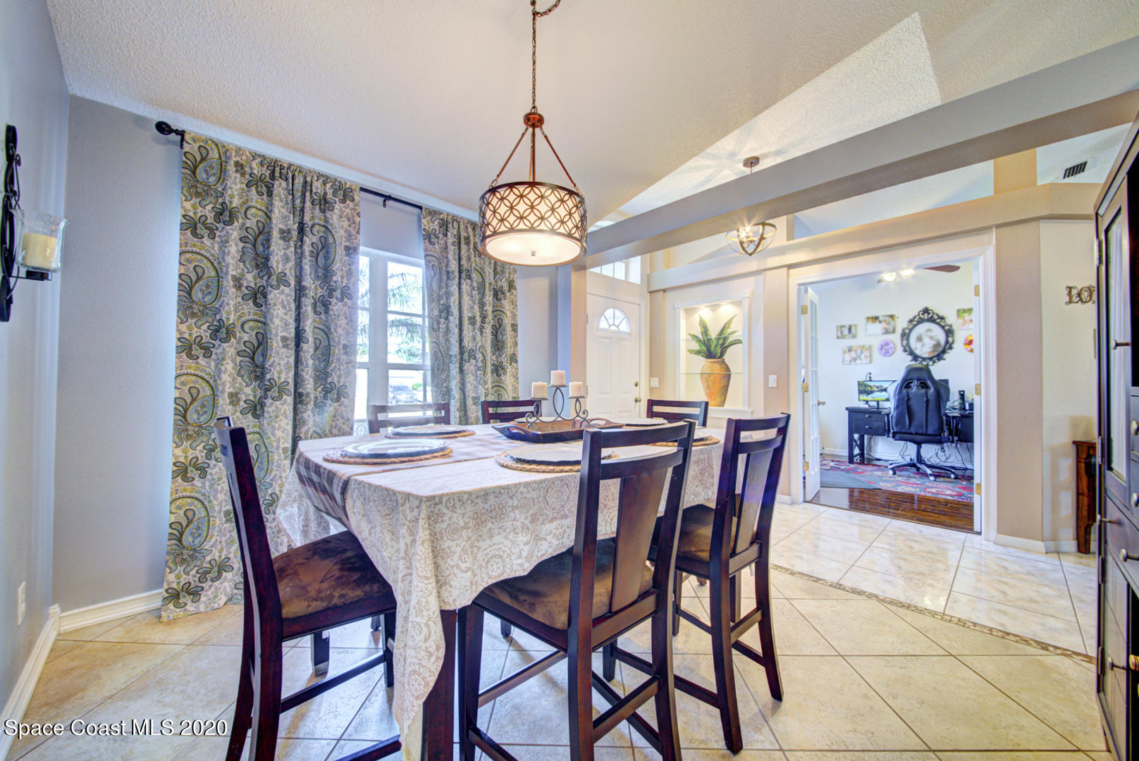 4359 Eastman Street Cocoa, FL 32927 - Photo 10 of 52 a view of a dining room with furniture window and wooden floor