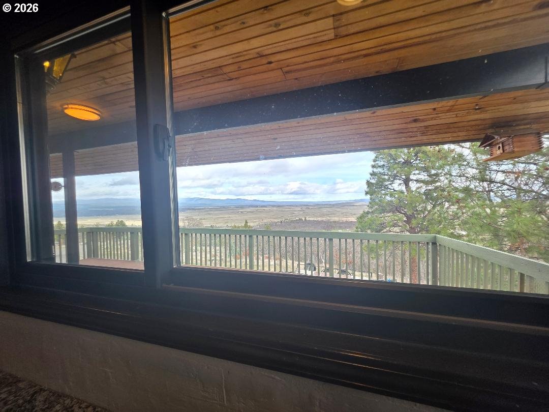 78902 Walters Road Maupin, OR 97037 - Photo 11 of 47 a view of a porch and a floor to ceiling window