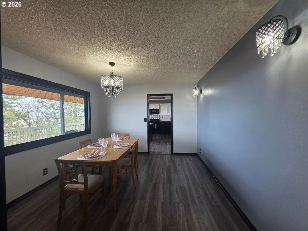 78902 Walters Road Maupin, OR 97037 - Photo 12 of 47 a view of a dining room with furniture window and wooden floor