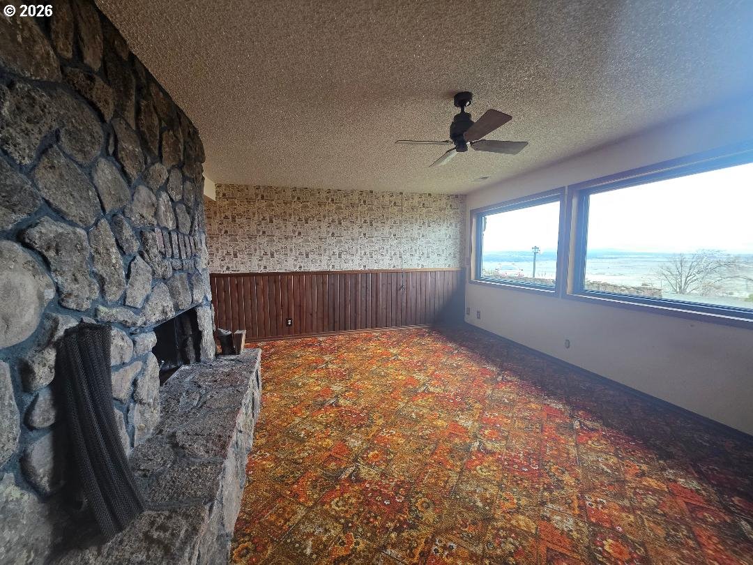 78902 Walters Road Maupin, OR 97037 - Photo 35 of 47 a view of an empty room with a fireplace and a window