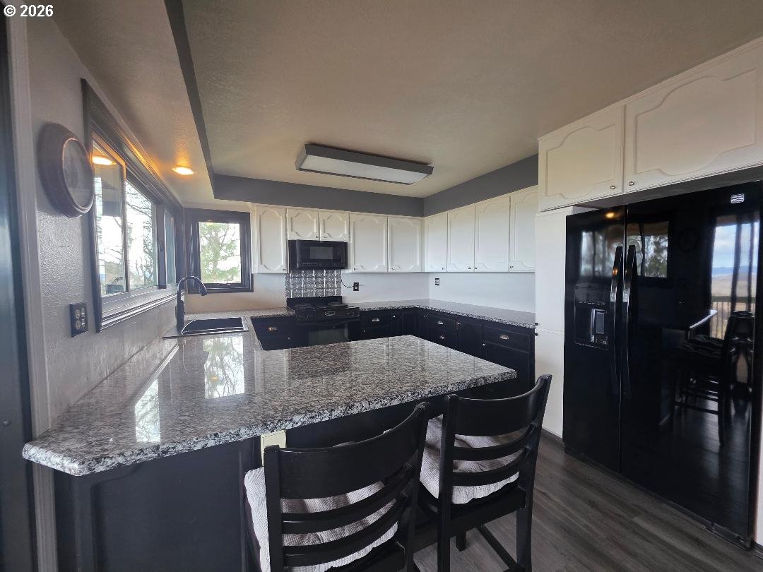78902 Walters Road Maupin, OR 97037 - Photo 8 of 47 a kitchen with granite countertop kitchen island stainless steel appliances a sink stove and cabinets