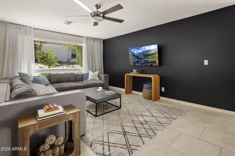 a living room with furniture and a window