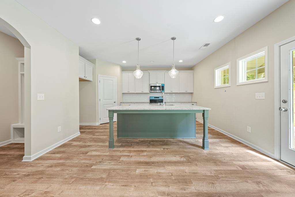 635 Bohannon Road Grantville, GA 30220 - Photo 14 of 43 a kitchen with kitchen island a sink stainless steel appliances and cabinets