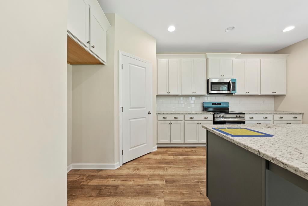 635 Bohannon Road Grantville, GA 30220 - Photo 18 of 43 a kitchen with stainless steel appliances granite countertop a stove a sink and a refrigerator