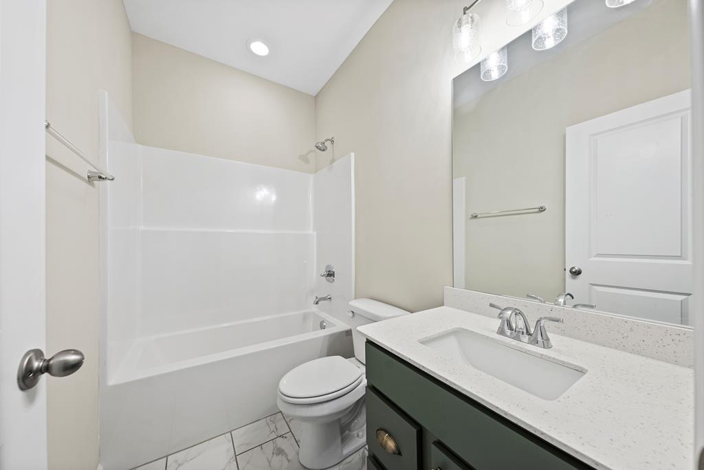 635 Bohannon Road Grantville, GA 30220 - Photo 19 of 43 a bathroom with a sink a toilet and shower