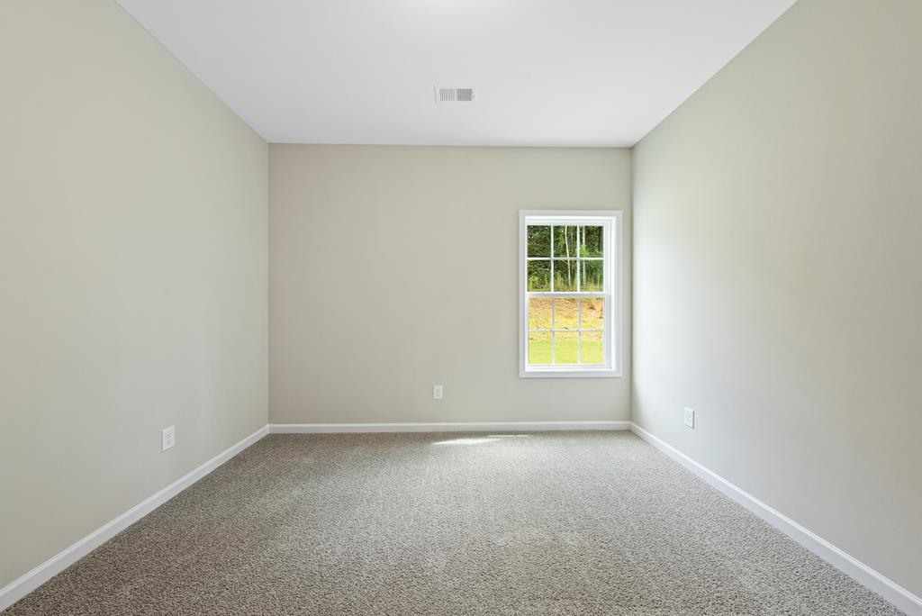635 Bohannon Road Grantville, GA 30220 - Photo 22 of 43 a view of an empty room with a window