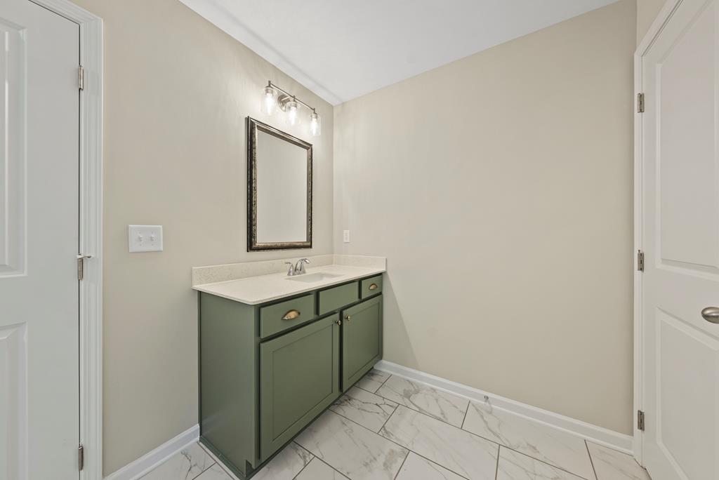 635 Bohannon Road Grantville, GA 30220 - Photo 26 of 43 a bathroom with a sink and mirror