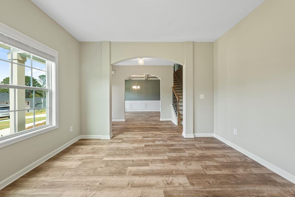 635 Bohannon Road Grantville, GA 30220 - Photo 5 of 43 a view of an empty room with window and wooden floor