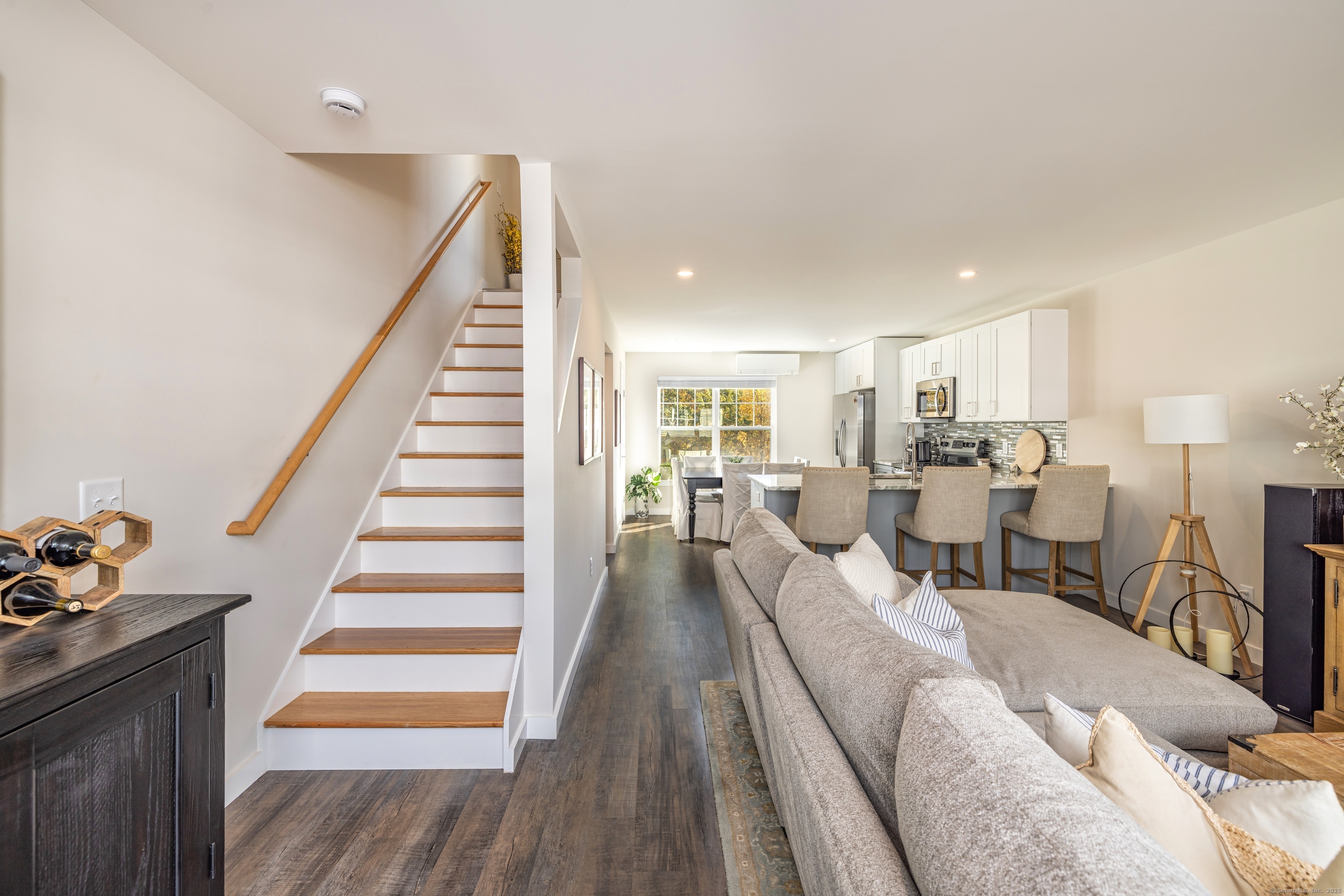 94 North Bridebrook Road, Unit 207 East Lyme, CT 06357 - Photo 7 of 18 a living room with furniture and wooden floor