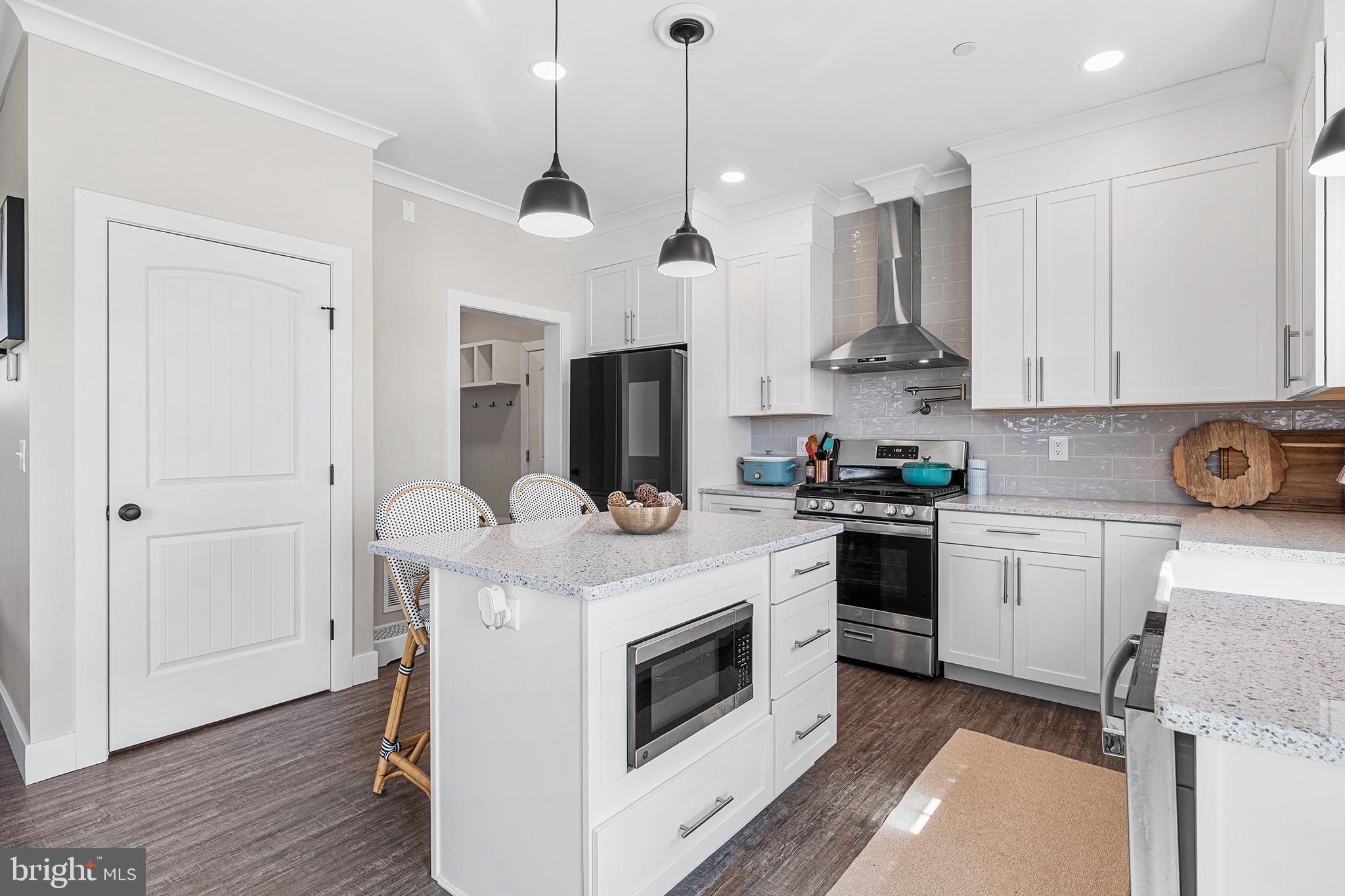 24766 Tribbett Circle Ridgely, MD 21660 - Photo 13 of 41 a kitchen with stainless steel appliances granite countertop a stove a sink and a refrigerator