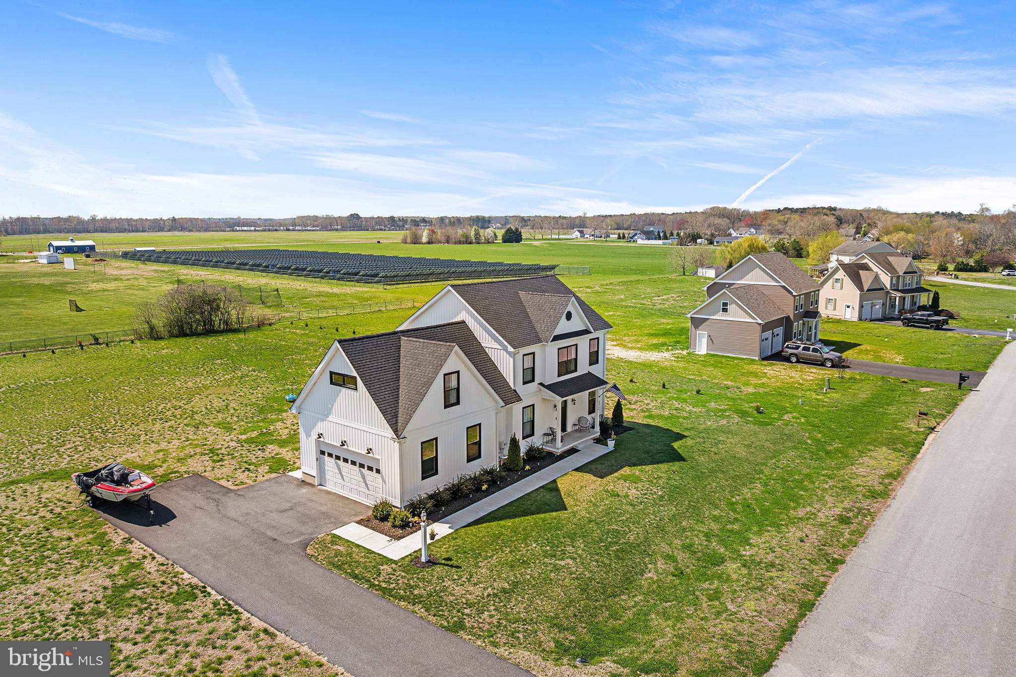 24766 Tribbett Circle Ridgely, MD 21660 - Photo 2 of 41 an aerial view of a house with outdoor space swimming pool and ocean view