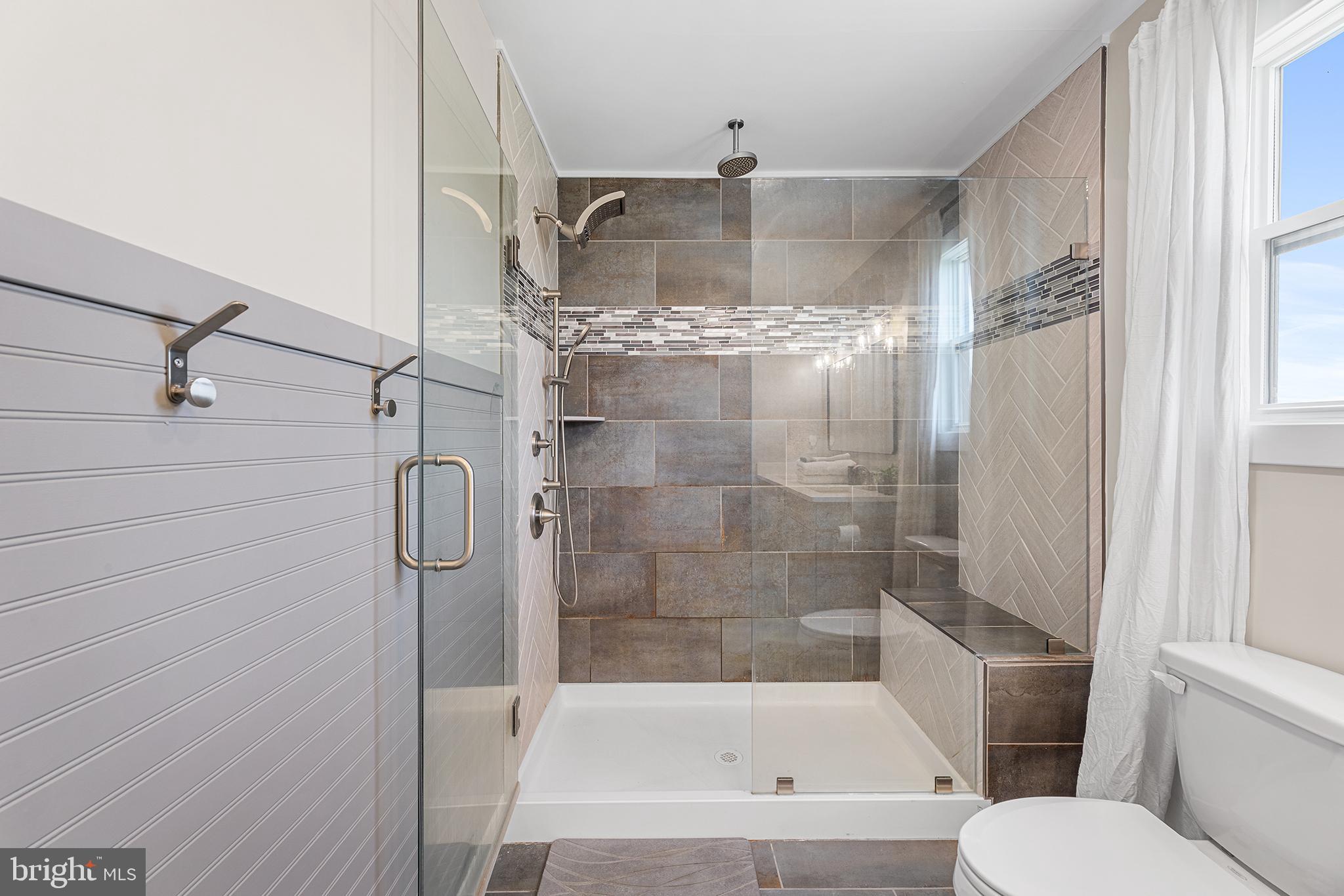 24766 Tribbett Circle Ridgely, MD 21660 - Photo 22 of 41 custom tiled shower with bench seat