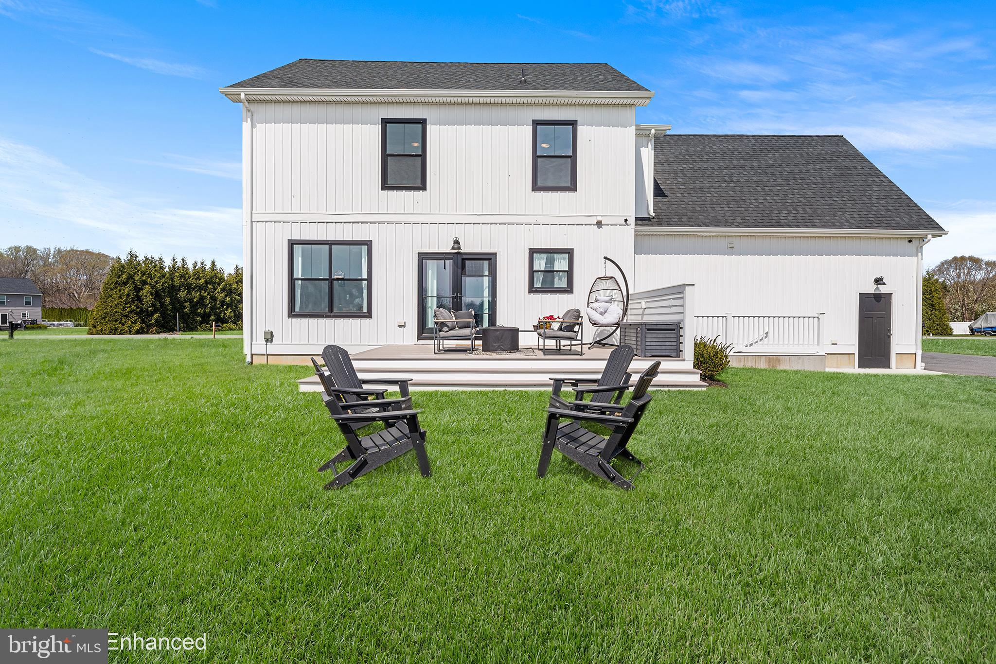 24766 Tribbett Circle Ridgely, MD 21660 - Photo 37 of 41 a view of a house with backyard sitting area and garden