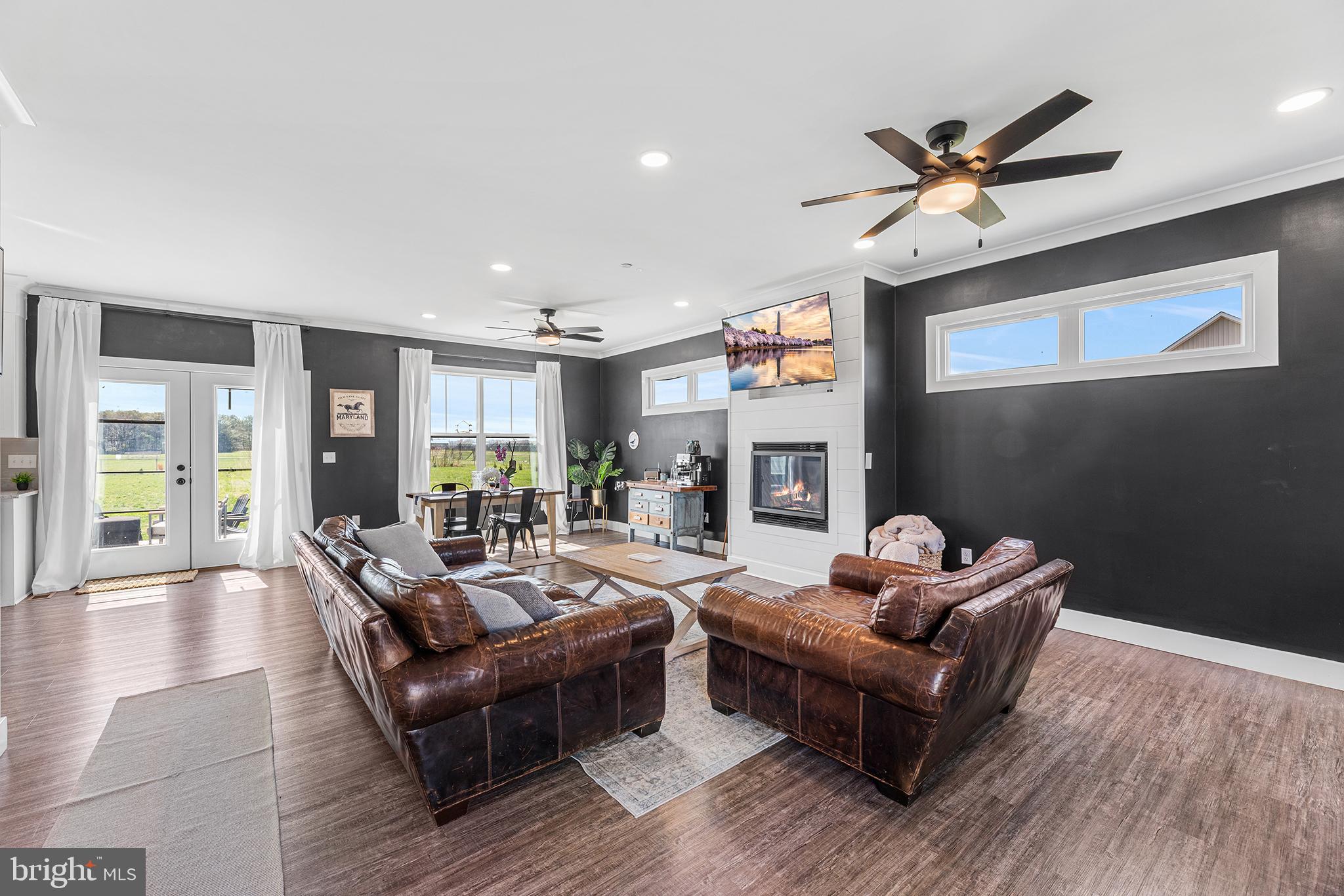 24766 Tribbett Circle Ridgely, MD 21660 - Photo 6 of 41 a living room with furniture and a wooden floor