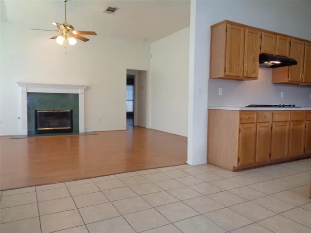 a kitchen with stainless steel appliances a stove a microwave and a refrigerator