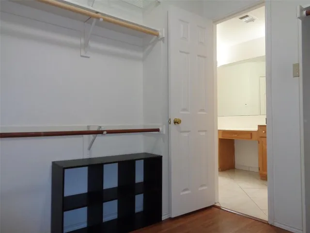 a view of an empty walk in closet