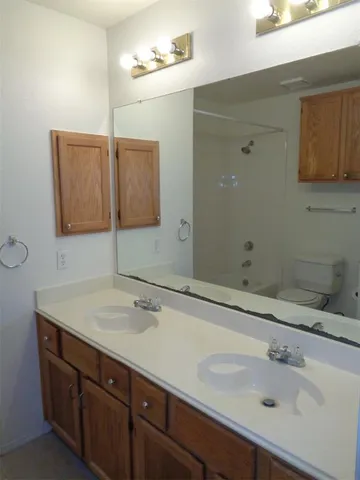 a bathroom with a toilet and a bathtub