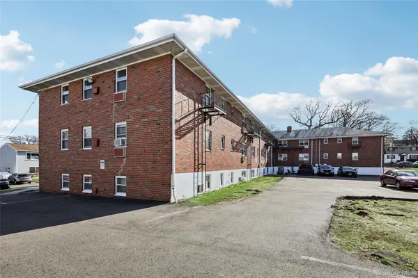 a big house with a large space in front of it