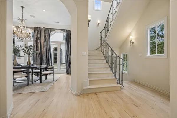 a view of a hallway with furniture and entryway