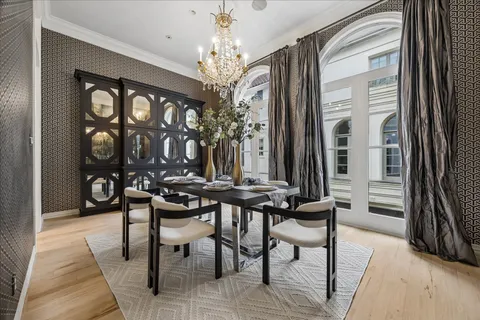 a view of a dining room with furniture and chandelier