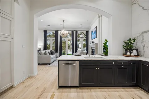 a spacious bathroom with a granite countertop sink and a large mirror