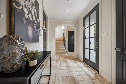 a lobby with furniture and a potted plant