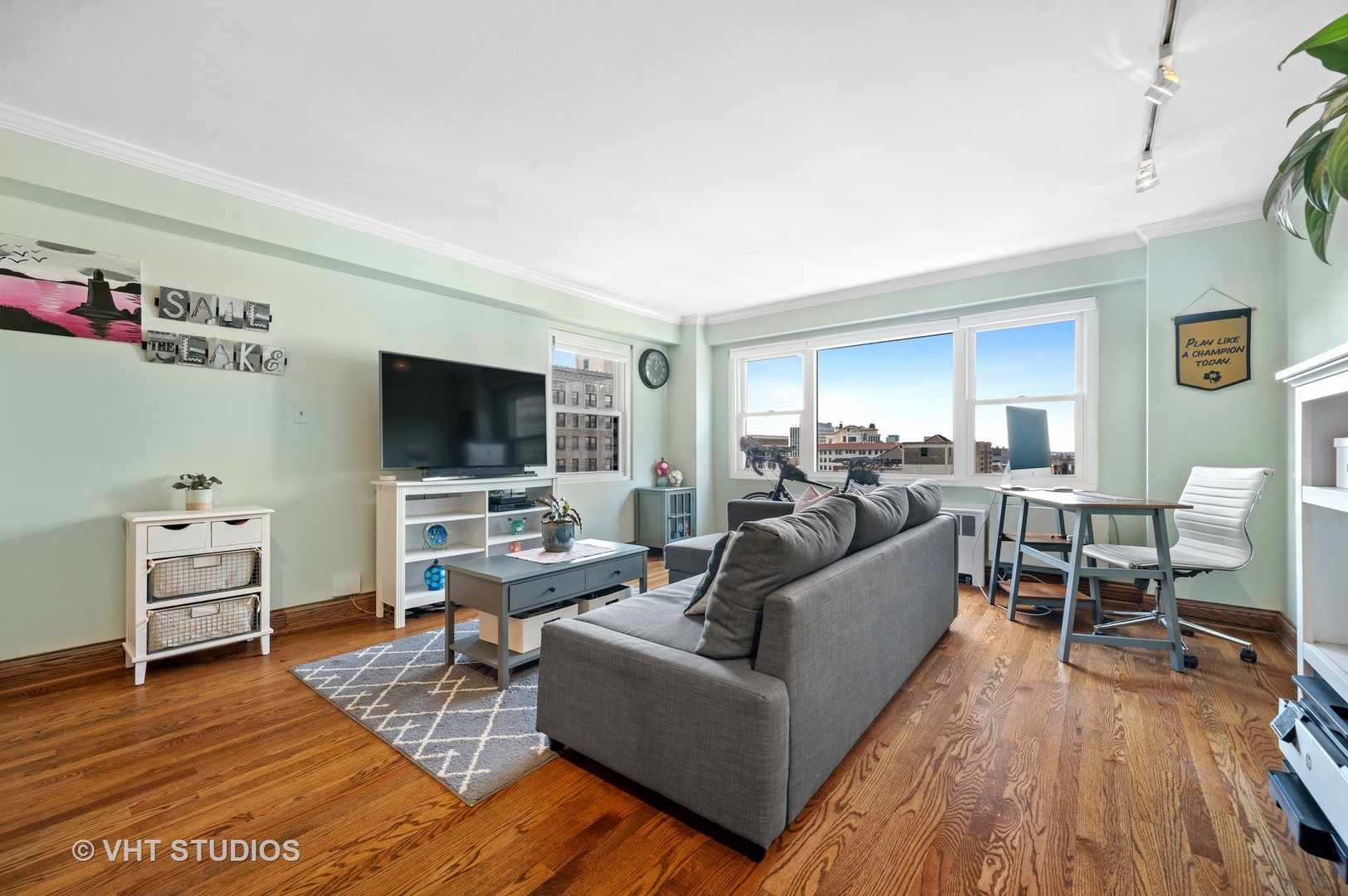 2909 North Sheridan Road, Unit 1105 Chicago, IL 60657 - Photo 2 of 11 a living room with furniture and a flat screen tv