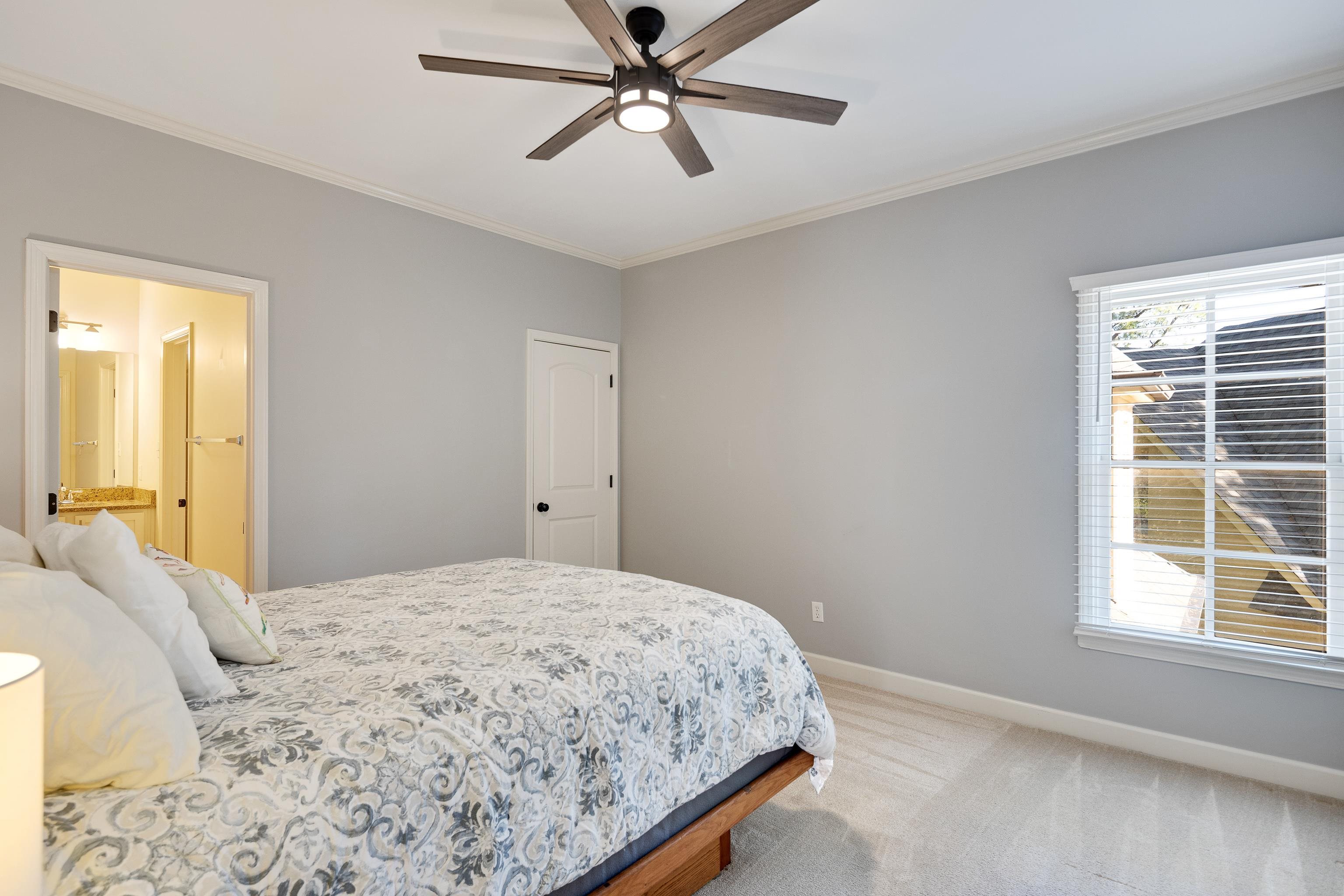 237 Windover Road Memphis, TN 38111 - Photo 28 of 37 Bedroom with ornamental molding, light colored carpet, a ceiling fan, and connected bathroom