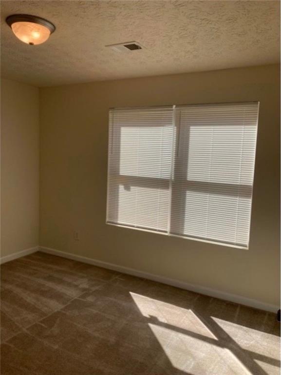 6102 Fairington Club Drive Lithonia, GA 30038 - Photo 6 of 12 an empty room with a window