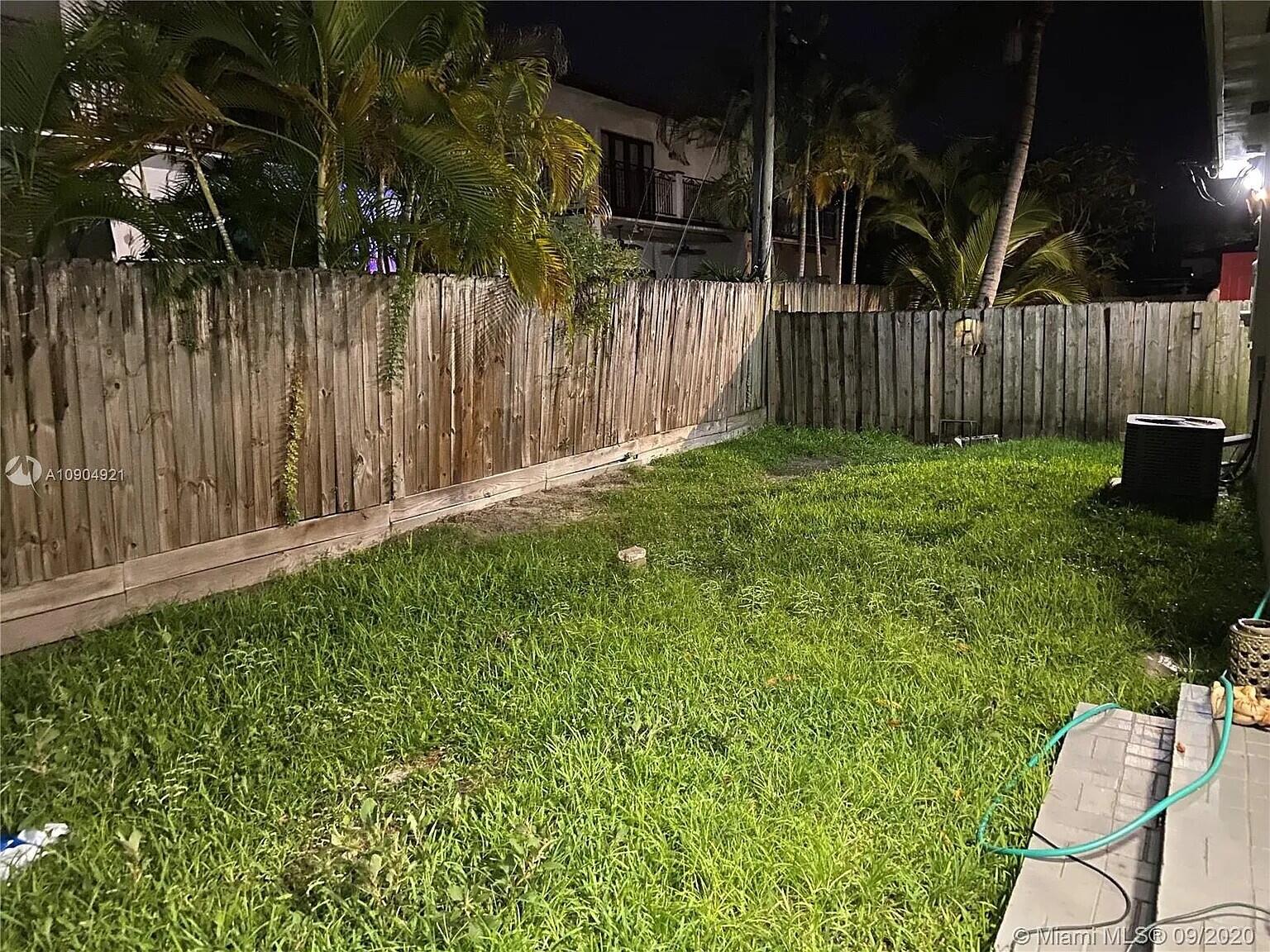 2633 Southwest 30th Court Miami, FL 33133 - Photo 13 of 24 a garden with wooden fence