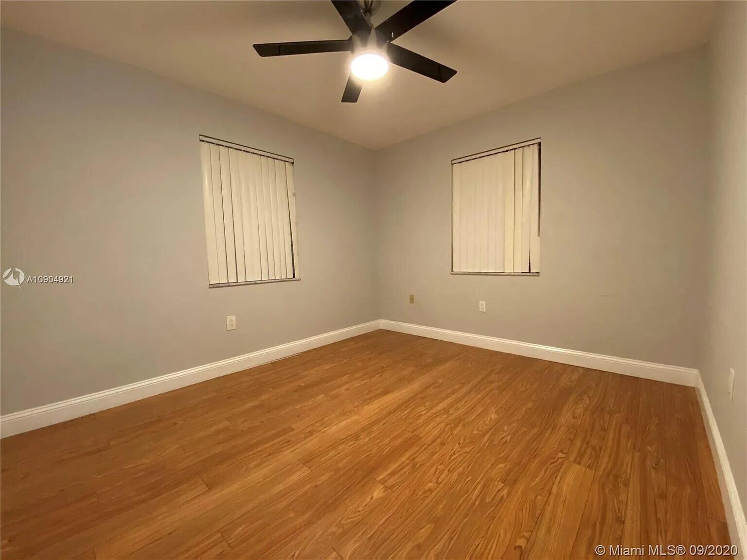 2633 Southwest 30th Court Miami, FL 33133 - Photo 24 of 24 a view of an empty room with wooden floor and a window