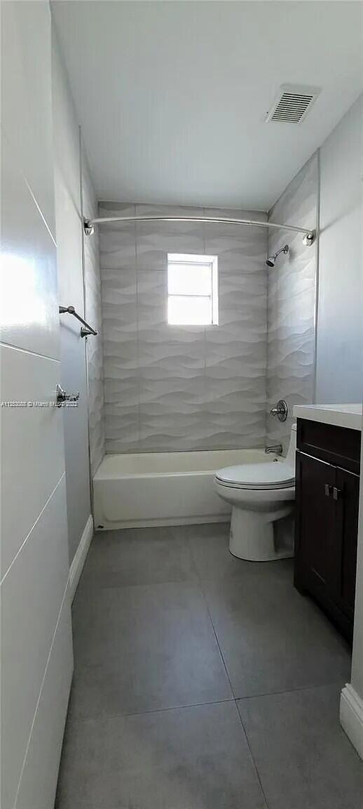 2633 Southwest 30th Court Miami, FL 33133 - Photo 8 of 24 a bathroom with a sink a toilet and shower