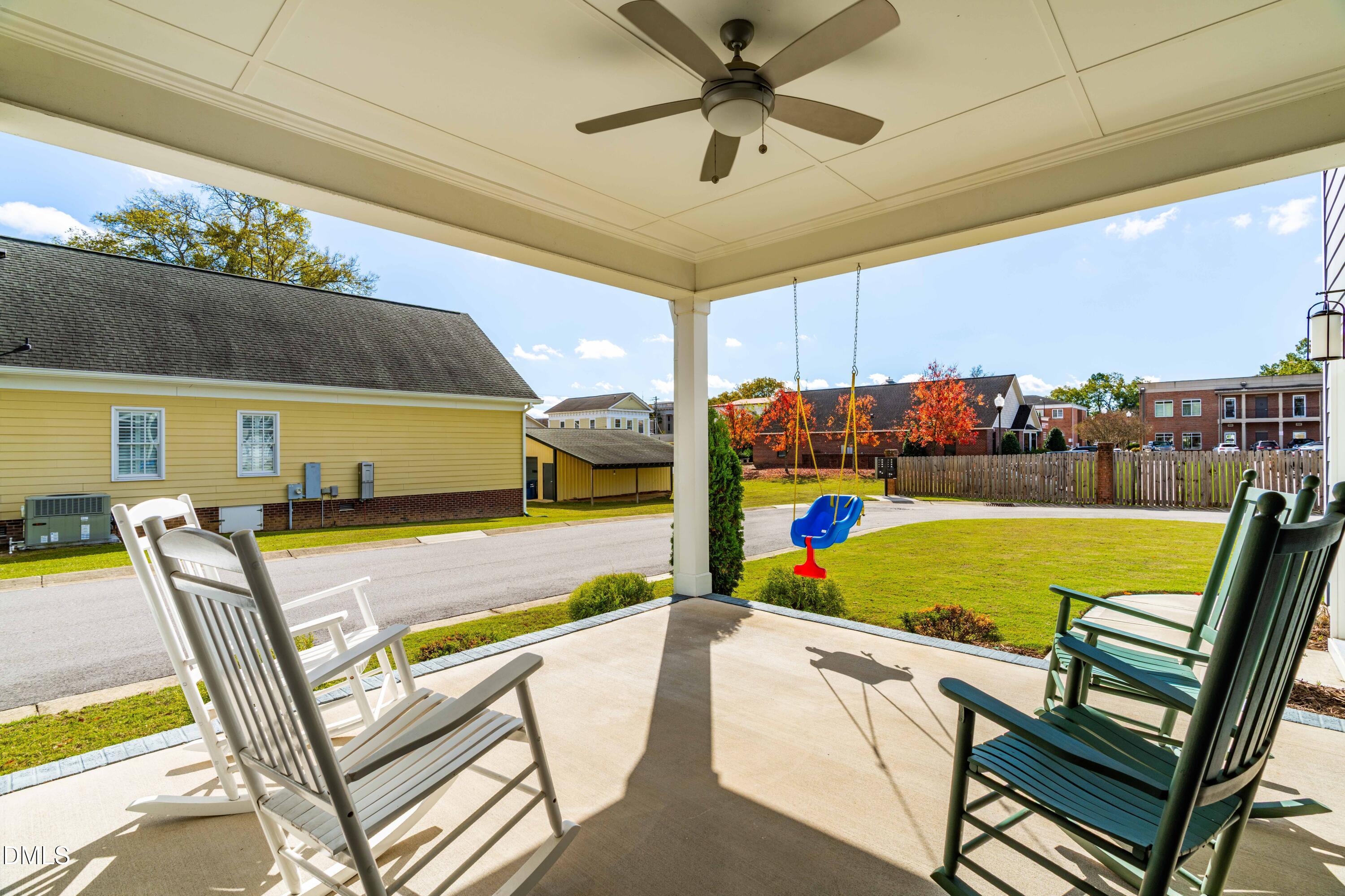 108 Bridge Street Smithfield, NC 27577 - Photo 35 of 48 a view of a swimming pool with a lounge chairs
