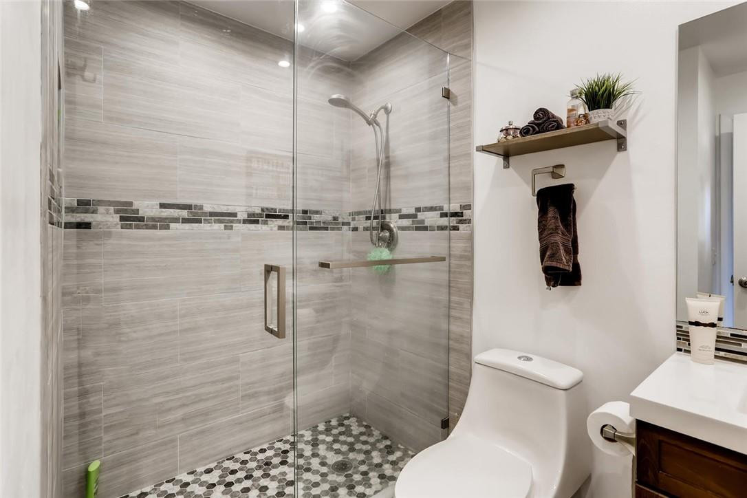 9763 West McNab Road, Unit 214 Tamarac, FL 33321 - Photo 14 of 28 a bathroom with a shower a toilet and a sink