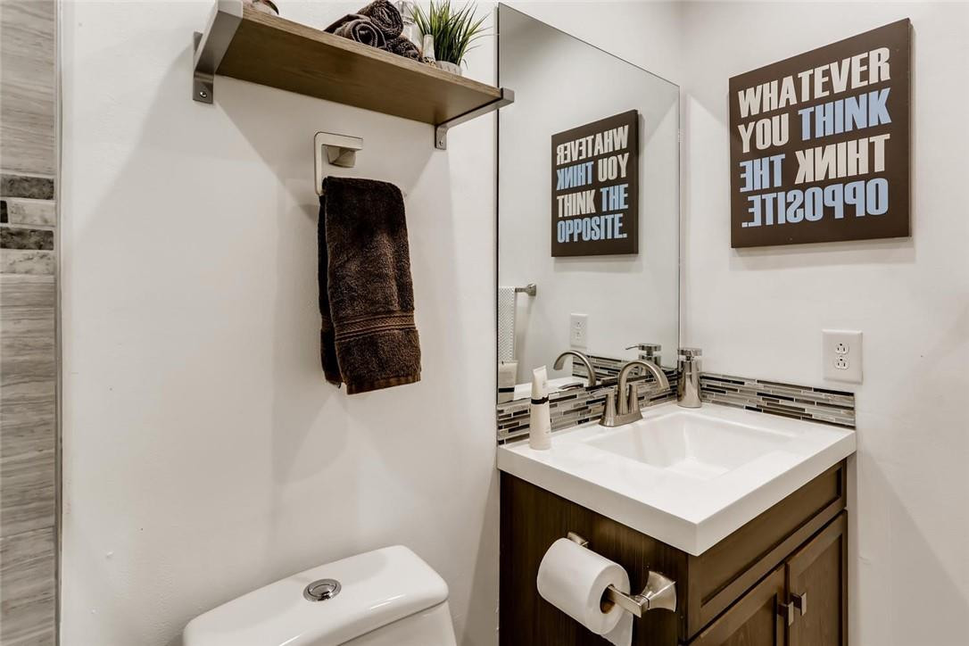 9763 West McNab Road, Unit 214 Tamarac, FL 33321 - Photo 15 of 28 a bathroom with a sink a vanity and a mirror