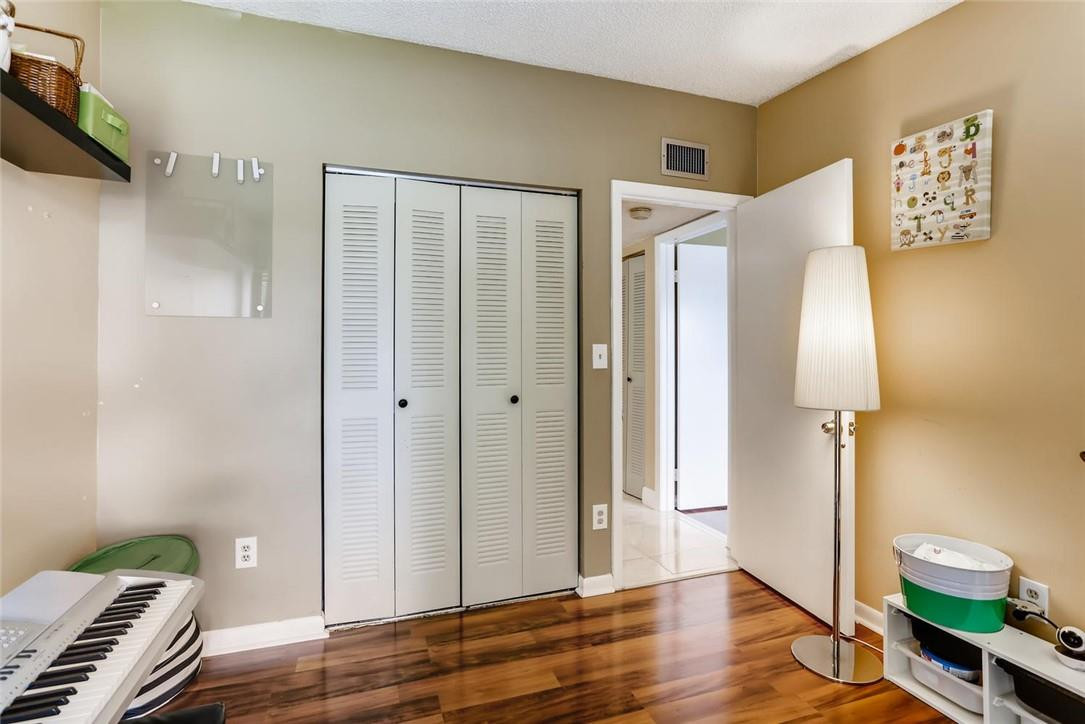 9763 West McNab Road, Unit 214 Tamarac, FL 33321 - Photo 17 of 28 a view of room with window and wooden floor