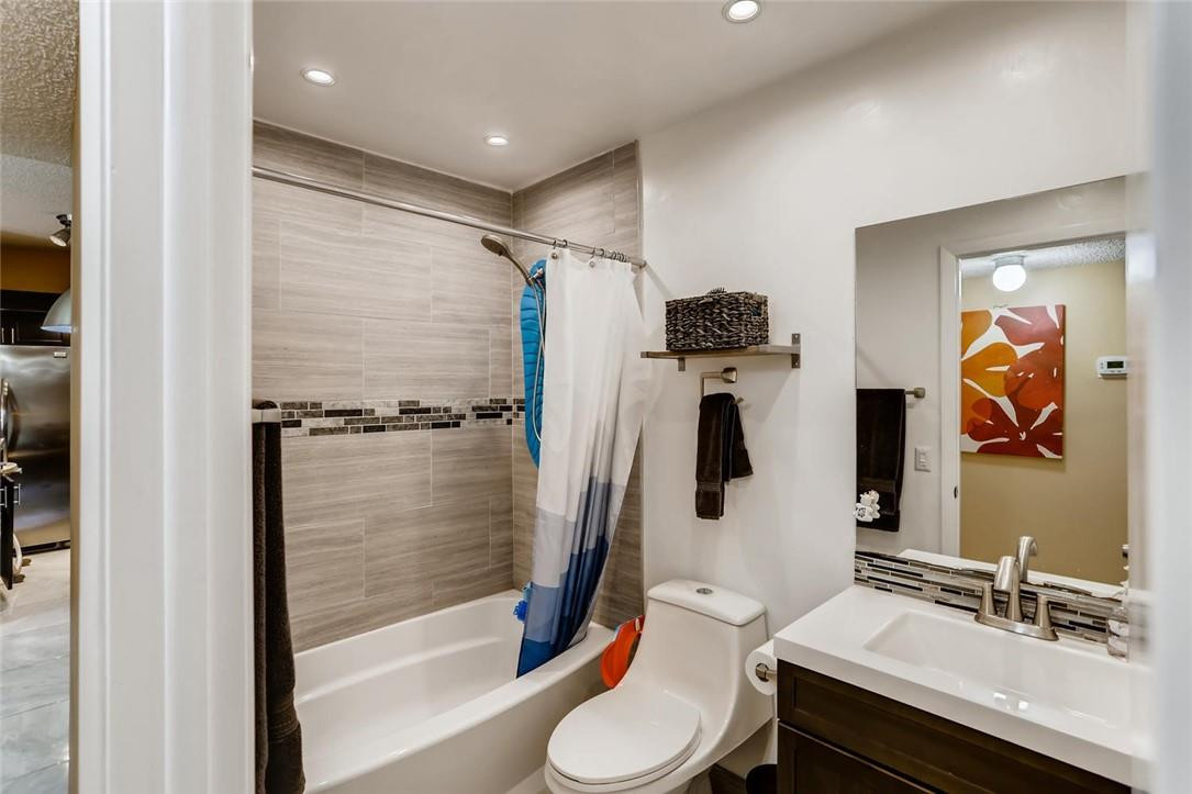 9763 West McNab Road, Unit 214 Tamarac, FL 33321 - Photo 18 of 28 a bathroom with a tub sink and toilet