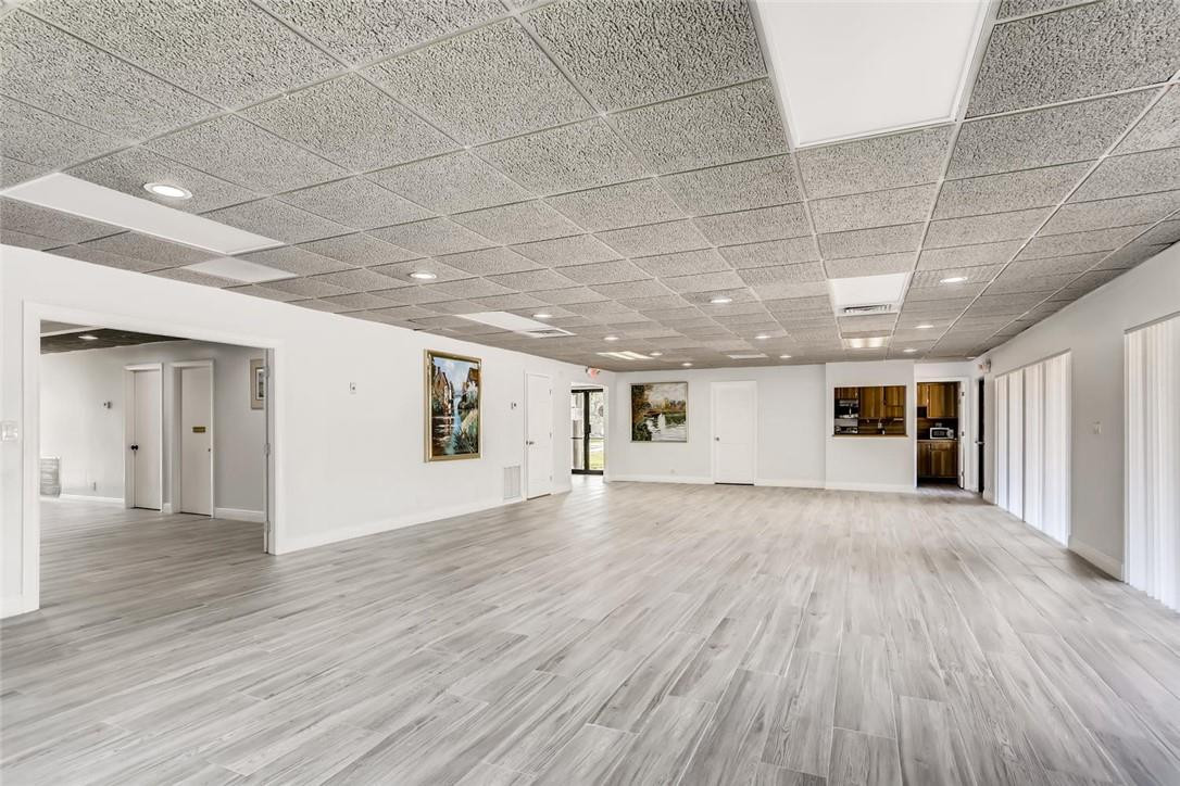9763 West McNab Road, Unit 214 Tamarac, FL 33321 - Photo 28 of 28 a view of empty room with wooden floor