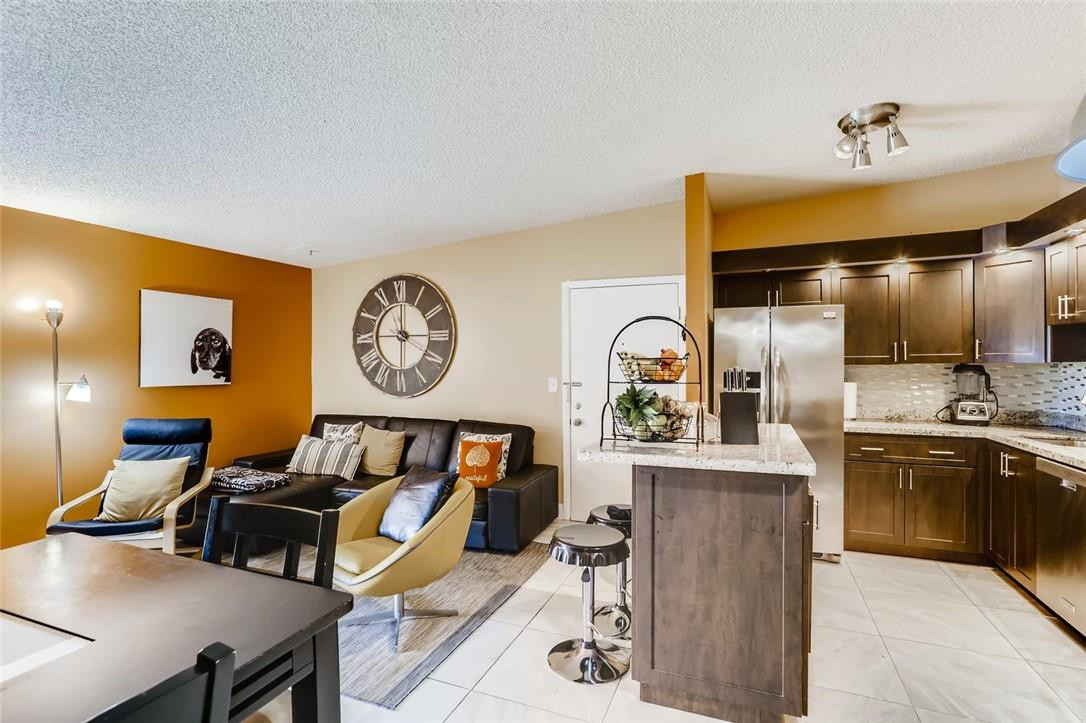 9763 West McNab Road, Unit 214 Tamarac, FL 33321 - Photo 6 of 28 a living room with furniture and a large window