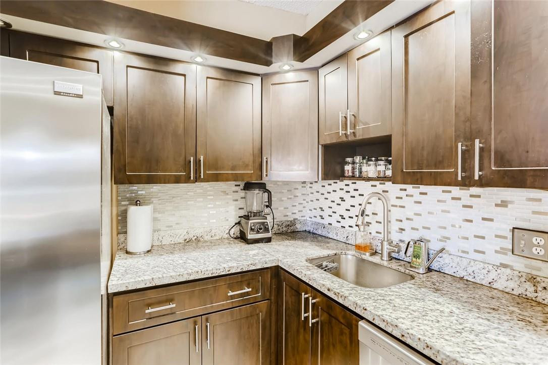 9763 West McNab Road, Unit 214 Tamarac, FL 33321 - Photo 9 of 28 a bathroom with a granite countertop sink and a mirror