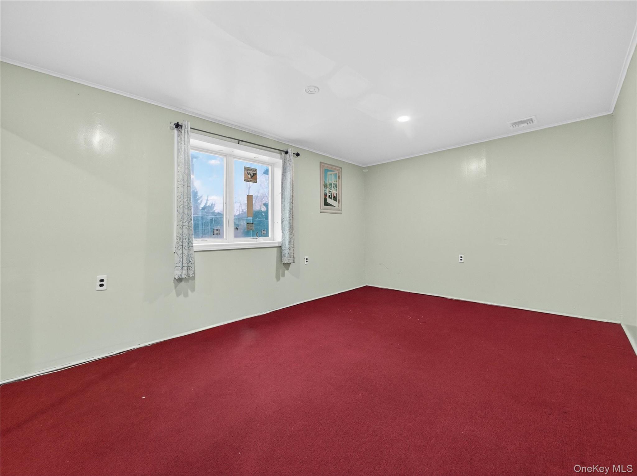 69 Gerow Avenue Spring Valley, NY 10977 - Photo 14 of 18 an empty room with windows