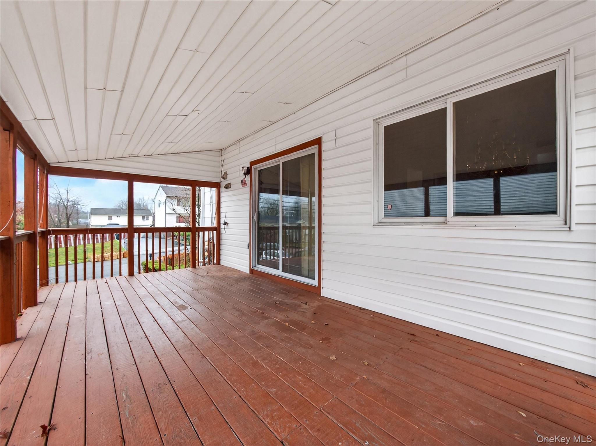 69 Gerow Avenue Spring Valley, NY 10977 - Photo 17 of 18 a view of an empty room with wooden floor and a window