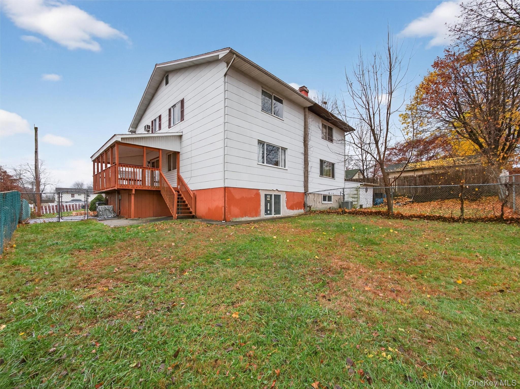 69 Gerow Avenue Spring Valley, NY 10977 - Photo 18 of 18 a front view of a house with a yard table and chairs