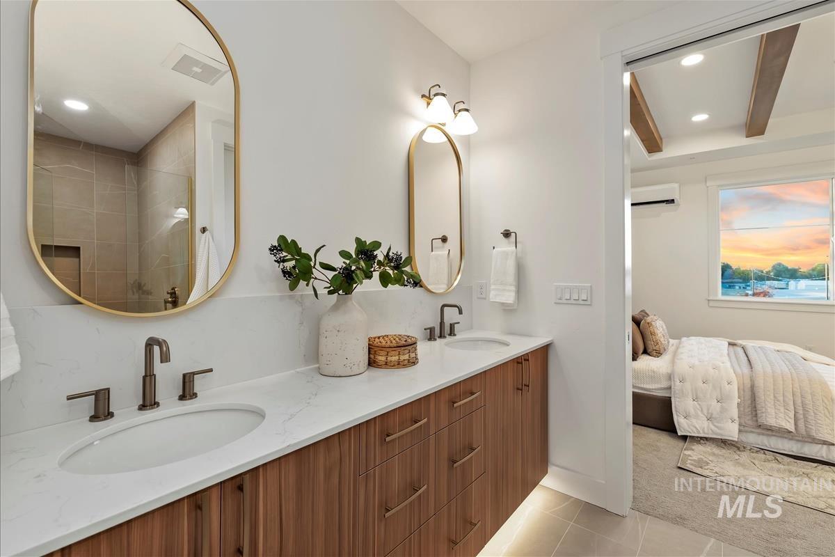 3243 West Moore Street Boise, ID 83702 - Photo 17 of 38 Full bath with recessed lighting, light tile patterned flooring, double vanity, ensuite bathroom, and tiled shower