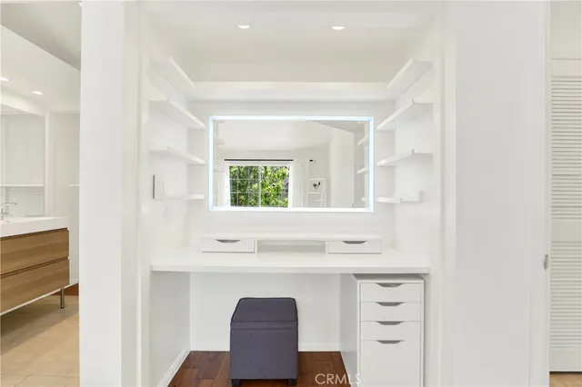 a bathroom with a sink vanity and a mirror
