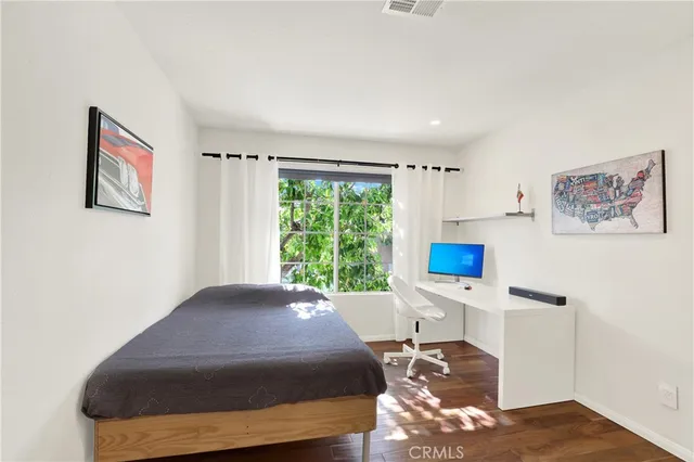 a room with a bed and a window